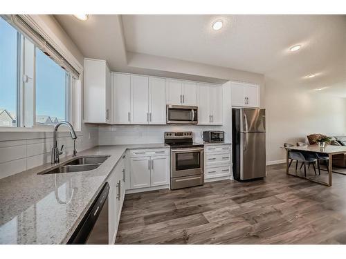 116 Carrington Boulevard Nw, Calgary, AB - Indoor Photo Showing Kitchen With Double Sink