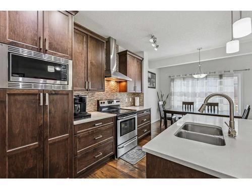 135 Masters Rise Se, Calgary, AB - Indoor Photo Showing Kitchen With Double Sink With Upgraded Kitchen