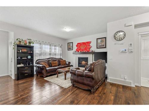 135 Masters Rise Se, Calgary, AB - Indoor Photo Showing Living Room With Fireplace