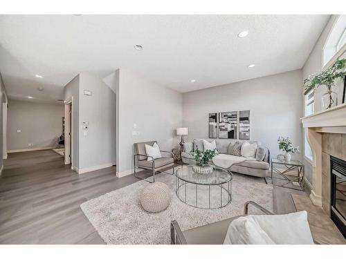 15 Saddleland Drive Ne, Calgary, AB - Indoor Photo Showing Living Room With Fireplace