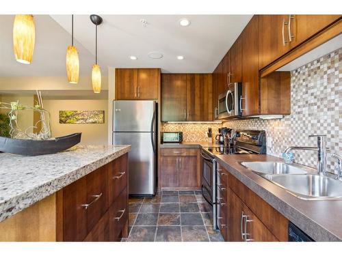 303-1818 Mountain Avenue, Canmore, AB - Indoor Photo Showing Kitchen With Double Sink