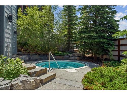 303-1818 Mountain Avenue, Canmore, AB - Outdoor With In Ground Pool With Backyard