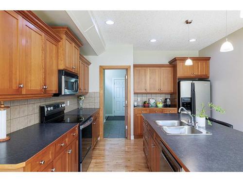 68 Tuscany Glen Road Nw, Calgary, AB - Indoor Photo Showing Kitchen With Stainless Steel Kitchen With Double Sink