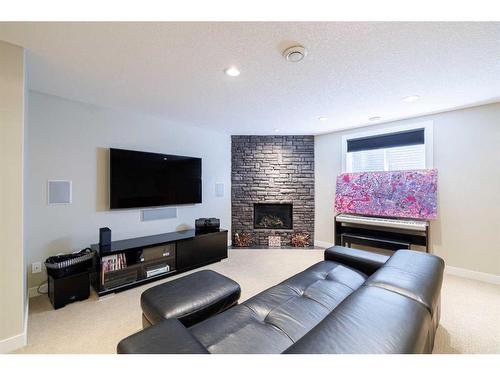 68 Tuscany Glen Road Nw, Calgary, AB - Indoor Photo Showing Living Room With Fireplace