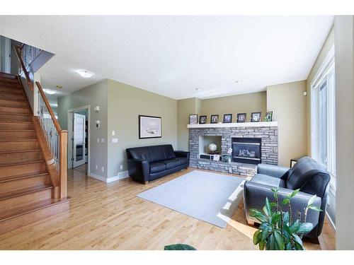 68 Tuscany Glen Road Nw, Calgary, AB - Indoor Photo Showing Living Room With Fireplace