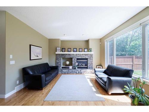 68 Tuscany Glen Road Nw, Calgary, AB - Indoor Photo Showing Living Room With Fireplace