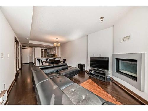 906-888 4 Avenue Sw, Calgary, AB - Indoor With Fireplace