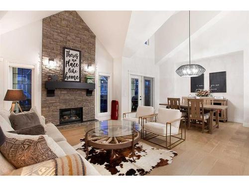 1149 Coopers Drive Sw, Airdrie, AB - Indoor Photo Showing Living Room With Fireplace