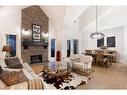 1149 Coopers Drive Sw, Airdrie, AB  - Indoor Photo Showing Living Room With Fireplace 