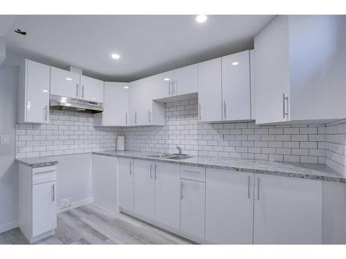 6 Tararidge Drive Ne, Calgary, AB - Indoor Photo Showing Kitchen With Upgraded Kitchen
