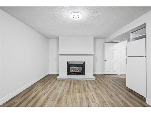 6112 4 Street Ne, Calgary, AB - Indoor Photo Showing Living Room With Fireplace