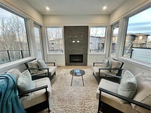 14 Rockcliff Terrace Nw, Calgary, AB - Indoor Photo Showing Living Room With Fireplace