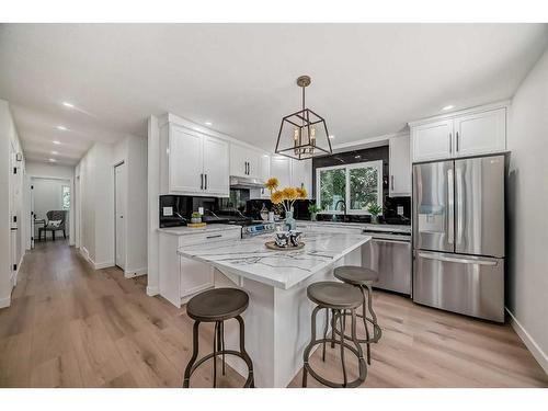 128 Cantrell Place Sw, Calgary, AB - Indoor Photo Showing Kitchen With Upgraded Kitchen