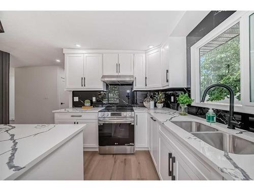 128 Cantrell Place Sw, Calgary, AB - Indoor Photo Showing Kitchen With Double Sink