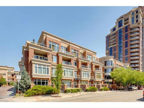 402-650 Eau Claire Avenue Sw, Calgary, AB - Outdoor With Balcony With Facade