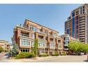 402-650 Eau Claire Avenue Sw, Calgary, AB  - Outdoor With Balcony With Facade 