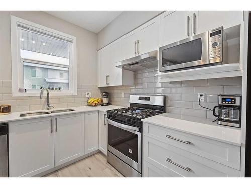 204-365 Redstone Walk Ne, Calgary, AB - Indoor Photo Showing Kitchen With Stainless Steel Kitchen With Double Sink