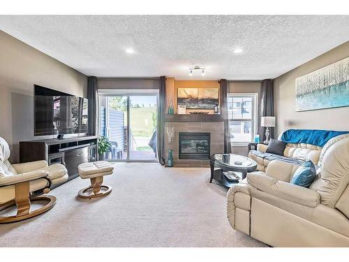 69 Chaparral Valley Gardens Se, Calgary, AB - Indoor Photo Showing Living Room With Fireplace