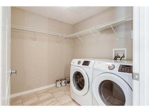 102-4350 Seton Drive Se, Calgary, AB - Indoor Photo Showing Laundry Room