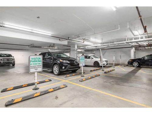 102-4350 Seton Drive Se, Calgary, AB - Indoor Photo Showing Garage