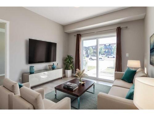 102-4350 Seton Drive Se, Calgary, AB - Indoor Photo Showing Living Room