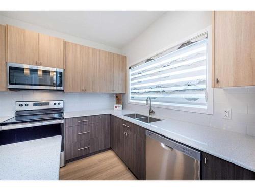 840 Midtown Drive, Airdrie, AB - Indoor Photo Showing Kitchen With Double Sink