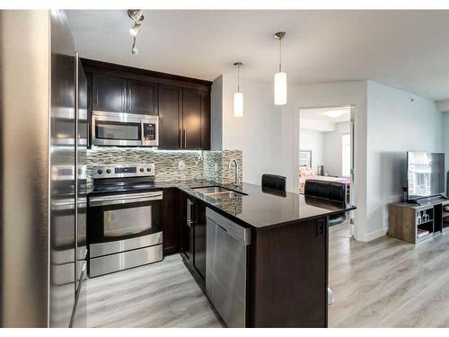 2406-155 Skyview Ranch Way Ne, Calgary, AB - Indoor Photo Showing Kitchen With Stainless Steel Kitchen With Double Sink With Upgraded Kitchen