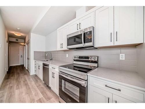 402-30 Sage Hill Walk Nw, Calgary, AB - Indoor Photo Showing Kitchen With Stainless Steel Kitchen