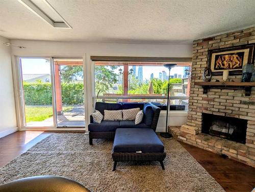 1021 Maggie Street Se, Calgary, AB - Indoor Photo Showing Living Room With Fireplace