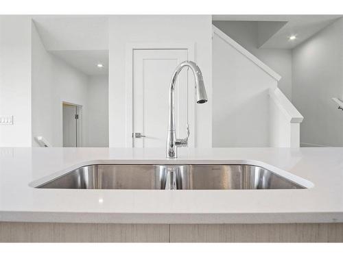 305 Dawson Way, Chestermere, AB - Indoor Photo Showing Kitchen With Double Sink