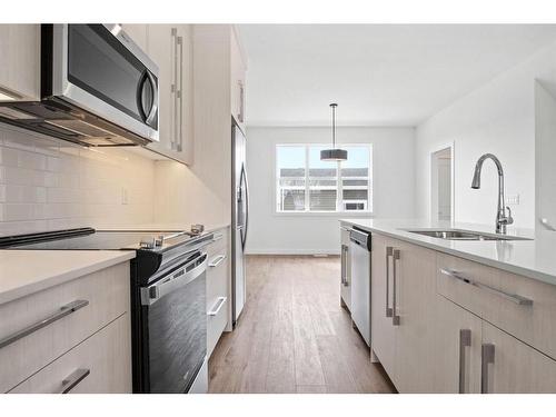 305 Dawson Way, Chestermere, AB - Indoor Photo Showing Kitchen With Double Sink With Upgraded Kitchen