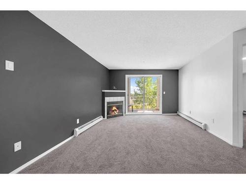 335-1717 60 Street Se, Calgary, AB - Indoor With Fireplace