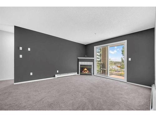 335-1717 60 Street Se, Calgary, AB - Indoor With Fireplace