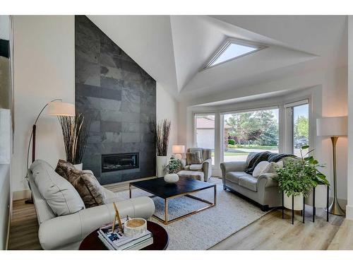 96 Woodpath Terrace Sw, Calgary, AB - Indoor Photo Showing Living Room With Fireplace