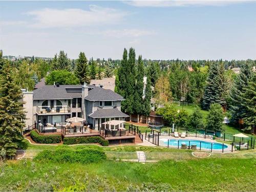 96 Woodpath Terrace Sw, Calgary, AB - Outdoor With In Ground Pool With Deck Patio Veranda