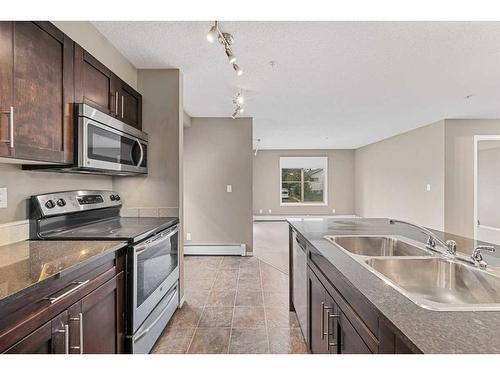 4201-1317 27 Street Se, Calgary, AB - Indoor Photo Showing Kitchen With Stainless Steel Kitchen With Double Sink