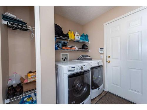 154 Bridlewood Court Sw, Calgary, AB - Indoor Photo Showing Laundry Room