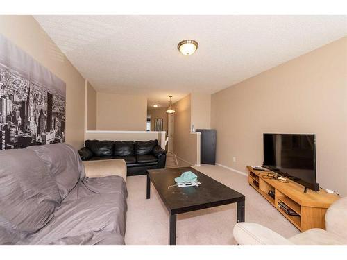 154 Bridlewood Court Sw, Calgary, AB - Indoor Photo Showing Living Room