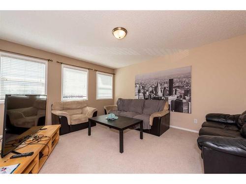 154 Bridlewood Court Sw, Calgary, AB - Indoor Photo Showing Living Room