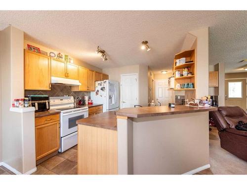 154 Bridlewood Court Sw, Calgary, AB - Indoor Photo Showing Kitchen