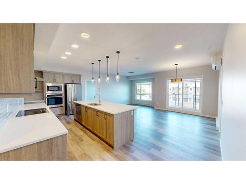 2310-220 Seton Grove Se, Calgary, AB - Indoor Photo Showing Kitchen With Stainless Steel Kitchen With Upgraded Kitchen