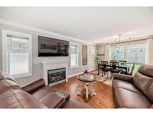 7 Cedarwood Lane Sw, Calgary, AB - Indoor Photo Showing Living Room With Fireplace