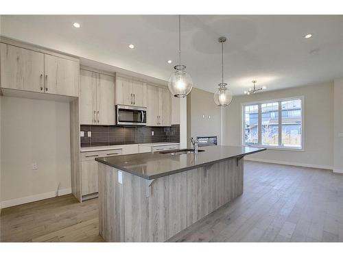 68 Shale Avenue, Cochrane, AB - Indoor Photo Showing Kitchen With Upgraded Kitchen