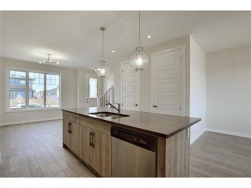 68 Shale Avenue, Cochrane, AB - Indoor Photo Showing Kitchen With Double Sink