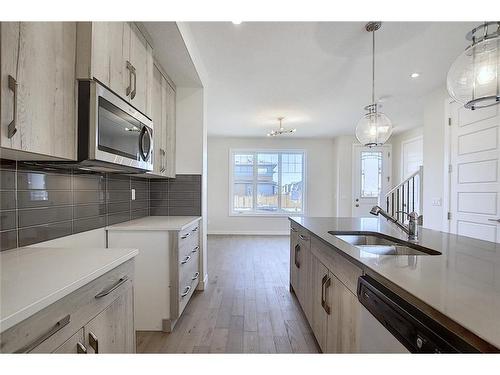 68 Shale Avenue, Cochrane, AB - Indoor Photo Showing Kitchen With Double Sink With Upgraded Kitchen