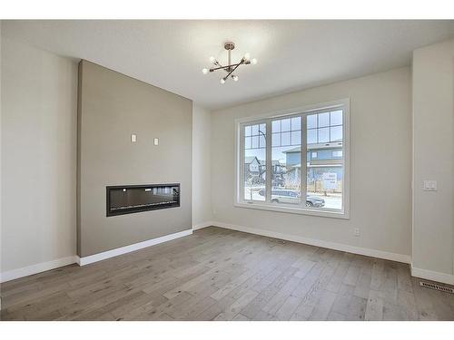 68 Shale Avenue, Cochrane, AB - Indoor Photo Showing Living Room With Fireplace