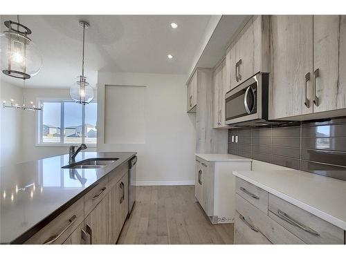 68 Shale Avenue, Cochrane, AB - Indoor Photo Showing Kitchen With Double Sink