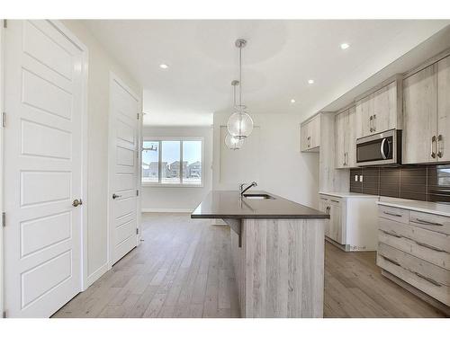 68 Shale Avenue, Cochrane, AB - Indoor Photo Showing Kitchen