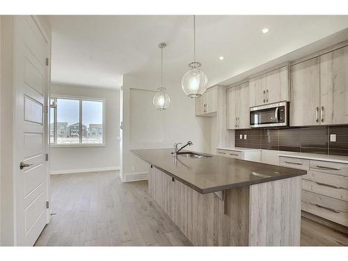 68 Shale Avenue, Cochrane, AB - Indoor Photo Showing Kitchen With Upgraded Kitchen