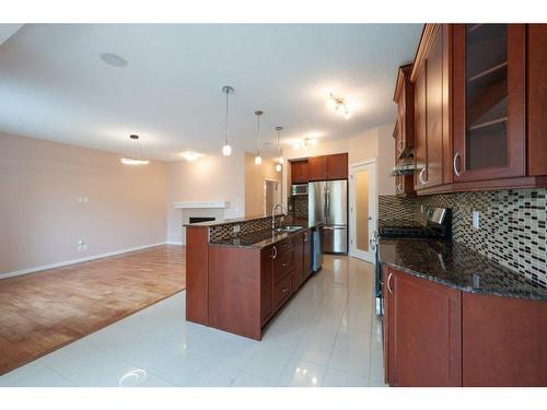 15 Cougar Ridge Rise Sw, Calgary, AB - Indoor Photo Showing Kitchen With Stainless Steel Kitchen